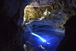 The colorful cave Poco Encantado with rays of light, Chapada Diamantina Mountains, Bahia, Brazil The colorful cave Poco Encantado with rays of light, Chapada Diamantina Mountains, Bahia, Brazil