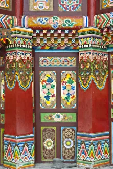 Colorful Tibetan designs on wall and columns of temple, Jiuzhaigou National Scenic Area Colorful Tibetan designs on wall and columns of temple, Jiuzhaigou National Scenic Area