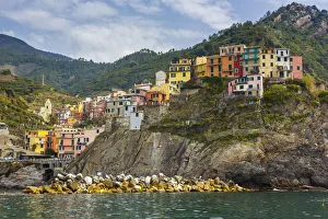 The colorful village of Manarola seen from a boat The colorful village of Manarola seen from a boat