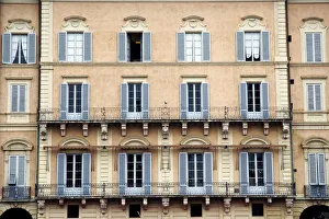 Colorful windows with shutters in Siena, Italy Colorful windows with shutters in Siena, Italy