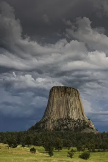 Columnar basalt formation and approaching thunderstorm, Devils Tower National Monument Columnar basalt formation and approaching thunderstorm, Devils Tower National Monument