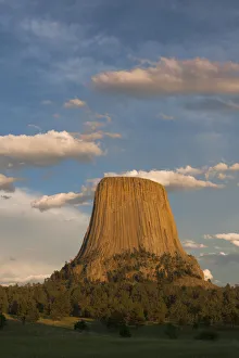 Columnar basalt formations with clouds at sunset, Devils Tower National Monument, Wyoming Columnar basalt formations with clouds at sunset, Devils Tower National Monument, Wyoming