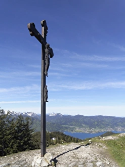 Cross on the summit of Baumgartenschneid mountain, lake Tegernsee and Bad Wiessee Cross on the summit of Baumgartenschneid mountain, lake Tegernsee and Bad Wiessee