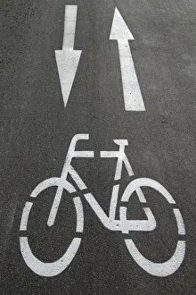Bicycle Lane Markings Prints: Cycle path, directional arrows, road markings on the asphalt