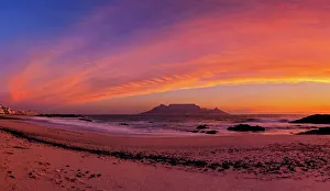 Dramatic Pink Sunset over Table Mountain from Blauwbergstrand Beach, Cape Town, Western Province, South Africa Dramatic Pink Sunset over Table Mountain from Blauwbergstrand Beach, Cape Town, Western Province, South Africa