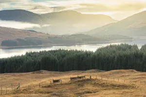 Dramatic sunset with atmospheric clouds over the mountainous Scottish landscape Dramatic sunset with atmospheric clouds over the mountainous Scottish landscape