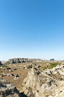 Dry and wide erosional landscape with rocks and trees, Isalo National Park, at Ranohira Dry and wide erosional landscape with rocks and trees, Isalo National Park, at Ranohira