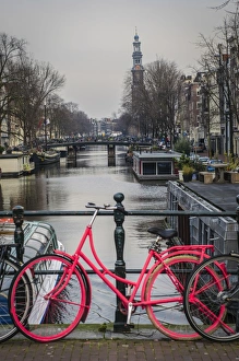 A Dutch Bicycle Parked on an Amsterdam Canal Bridge A Dutch Bicycle Parked on an Amsterdam Canal Bridge