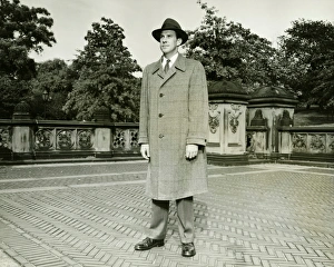 Elegant man standing on courtyard, (B&W), (Portrait) Elegant man standing on courtyard, (B&W), (Portrait)