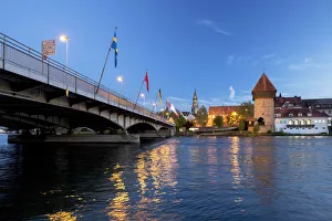 Evening mood at the old bridge over the Rhine with Konstanz Minster or Konstanz Cathedral Evening mood at the old bridge over the Rhine with Konstanz Minster or Konstanz Cathedral