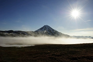 The extinct Tolmachev Dol volcano in the morning light, Kamchatka Peninsula, Russia The extinct Tolmachev Dol volcano in the morning light, Kamchatka Peninsula, Russia