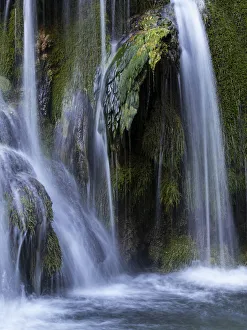 Extreme silky water jets in a waterfall with moss Extreme silky water jets in a waterfall with moss