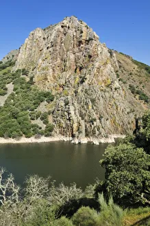 Famous bird rock Pena Falcon on Tajo river, Parque Nacional de Monfraguee National Park Famous bird rock Pena Falcon on Tajo river, Parque Nacional de Monfraguee National Park