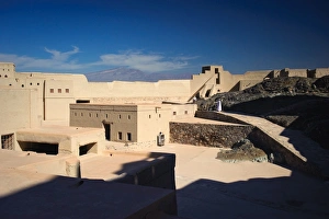 Father and son exploring the main courtyard of Bahla Fort, Oman Father and son exploring the main courtyard of Bahla Fort, Oman