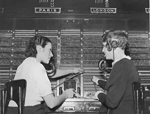 Images Dated 30th August 2005: Two female switchboard operators connecting international calls (B&W)