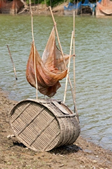 Fish trap made of bamboo and a fishing net on the Sangkae