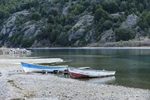 Fishing boats on the shore of Lago Bertrand at the mouth of Baker River, Bertrand, Aysen Fishing boats on the shore of Lago Bertrand at the mouth of Baker River, Bertrand, Aysen