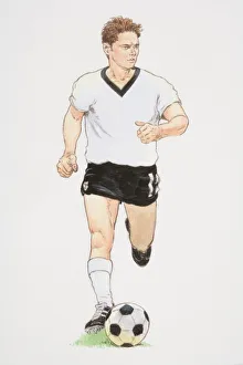 Football player in white T-shirt and black shorts running with football in front of him, front view Football player in white T-shirt and black shorts running with football in front of him, front view