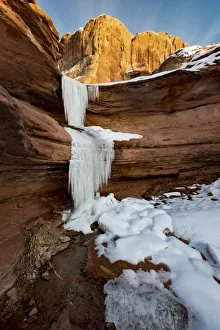 Frozen waterfalls and red rock cliffs along Colorado River near Moab, Utah, USA Frozen waterfalls and red rock cliffs along Colorado River near Moab, Utah, USA