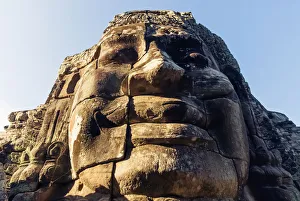 Giant carved stone faces, Bayon temple, Angkor Giant carved stone faces, Bayon temple, Angkor