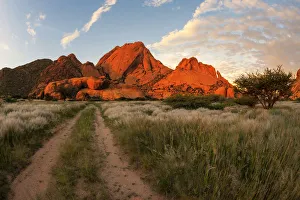 The Glowing Red Granite Rock Formations of Spitzkoppe at Sunset in the Erongo Region The Glowing Red Granite Rock Formations of Spitzkoppe at Sunset in the Erongo Region