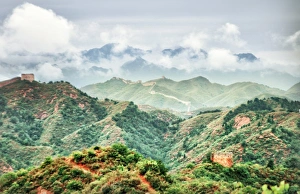 Great Wall of China unrestored cloudy sky and fog Great Wall of China unrestored cloudy sky and fog