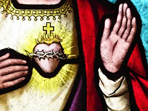 Heart and hands of Jesus Christ on an old stained glass Heart and hands of Jesus Christ on an old stained glass