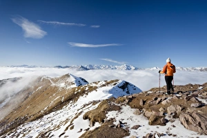 Hikers on Grosser Laugenspitze Mountain above Laugenalm alpine pasture Hikers on Grosser Laugenspitze Mountain above Laugenalm alpine pasture
