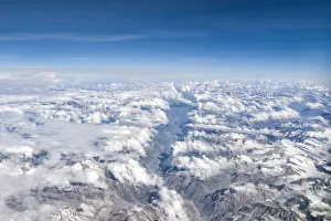 Himalaya mountains under clouds. View from the airplane. India, Ladakh Himalaya mountains under clouds. View from the airplane. India, Ladakh