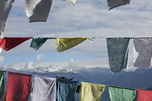 Himalayas seen through prayer flags, Dorcha La Pass, Bhutan Himalayas seen through prayer flags, Dorcha La Pass, Bhutan