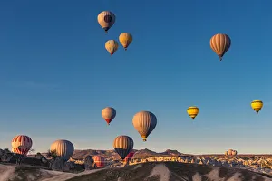 Hot air balloon over cappadocia rock landscape Hot air balloon over cappadocia rock landscape