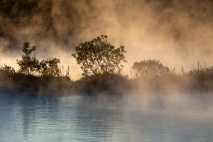 Hot spring, thermal lake, evening light, near Husavik, Iceland Hot spring, thermal lake, evening light, near Husavik, Iceland