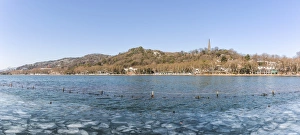 Ice floes floating on the West Lake against Baoshi Hill , Hangzhou, Zhejiang, China Ice floes floating on the West Lake against Baoshi Hill , Hangzhou, Zhejiang, China
