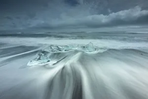 Ice rests on the beach off the inlet to Jokulsarlon Glacial Lagoon in southwest Iceland Ice rests on the beach off the inlet to Jokulsarlon Glacial Lagoon in southwest Iceland