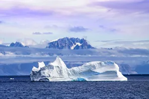 Iceberg and mountains at sunrise, Kujalleq, Prinz Christian Sund fjord, Greenland Iceberg and mountains at sunrise, Kujalleq, Prinz Christian Sund fjord, Greenland