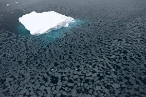 Iceberg surrounded by slush, Paradise Bay, Antarctic Peninsula, Antarctica Iceberg surrounded by slush, Paradise Bay, Antarctic Peninsula, Antarctica