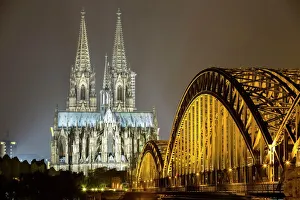 The illuminated Cologne Cathedral and Hohenzollern Bridge at night, Deutz, Cologne The illuminated Cologne Cathedral and Hohenzollern Bridge at night, Deutz, Cologne