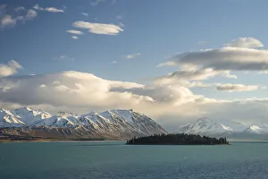 Island in Lake Tekapo in front of a mountain range, Canterbury Region, South Island, New Zealand Island in Lake Tekapo in front of a mountain range, Canterbury Region, South Island, New Zealand
