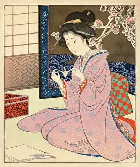 Japanese Woodblock of a female making Origami Japanese Woodblock of a female making Origami