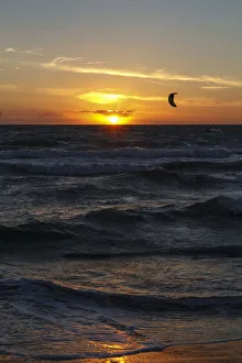 Kitesurfer at sunset, Baltic Sea, Wustrow, Mecklenburg-Western Pomerania, Germany Kitesurfer at sunset, Baltic Sea, Wustrow, Mecklenburg-Western Pomerania, Germany