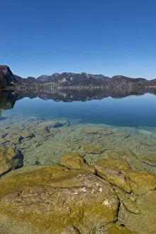 Lake Wolfgang with a reflection of the surrounding mountains, near St. Gilgen, Salzkammergut, Salzburger Land Lake Wolfgang with a reflection of the surrounding mountains, near St. Gilgen, Salzkammergut, Salzburger Land