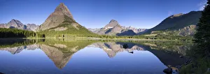 Landscape of Glacier National Park with mountains reflected in lake, Glacier National Park, Montana, USA Landscape of Glacier National Park with mountains reflected in lake, Glacier National Park, Montana, USA