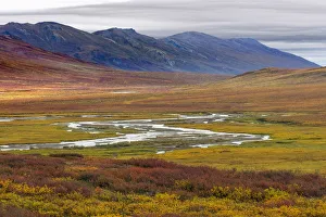 Landscape with tundra and mountain range in Brooks Range, Alaska, USA Landscape with tundra and mountain range in Brooks Range, Alaska, USA