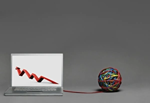 Laptop showing graph connected to cable ball Laptop showing graph connected to cable ball