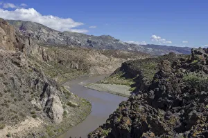 Lava of the Cerro Payun volcano and the Grande river, Mendoza province, Argentina Lava of the Cerro Payun volcano and the Grande river, Mendoza province, Argentina