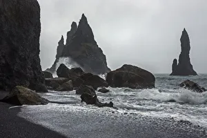 Lava rocks and rock needles at the black lava beach Reynisfjara, near Vik, South Iceland Lava rocks and rock needles at the black lava beach Reynisfjara, near Vik, South Iceland