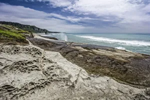 Limestone formations and a blowhole, Truman Bay, West Coast, South Island, New Zealand Limestone formations and a blowhole, Truman Bay, West Coast, South Island, New Zealand