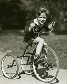 Little boy riding his tricycle Our beautiful Wall Art and Photo Gifts include Framed Prints Photo Prints Poster Prints Canvas Prints Jigsaw Puzzles Metal Prints and so much more