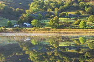 Little Langdale tarn autumn reflections, Lake District, UK Little Langdale tarn autumn reflections, Lake District, UK
