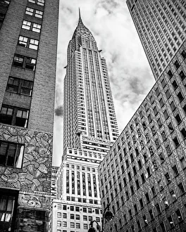 <b class=qtipBold><figcaption>Looking up at the Chrysler Building</figcaption></b><br>The iconic Chrysler Building in New York City photographed from below in black and white in context of neighbouring buildings.<br><em>© Sherry Galey</em> Looking up at the Chrysler Building
